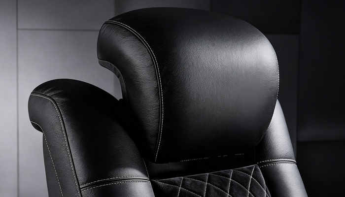 Close-up of the headrest of the Tarantino Console Suede Power Reclining Home Theater Recliner Sofa.